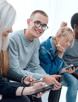 close up. casual group of young people with smartphones. people and technology