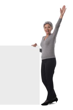 Mature asian business woman is holding empty text sign over white background