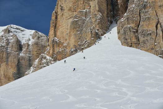 jumping skier at mountain winter snow fresh suny day