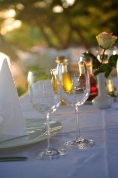 empty vine glasses at outdoor restaurant 