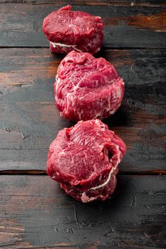 Prime Raw Fillet Mignon tenderloin steaks set, on old dark wooden table background