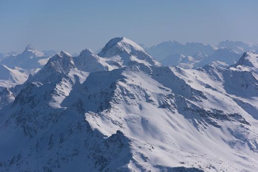 mountain landscape at winter with fresh snow on beautiful sunny day at french alps