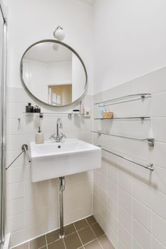 Beautiful washbasin with sink and round mirror