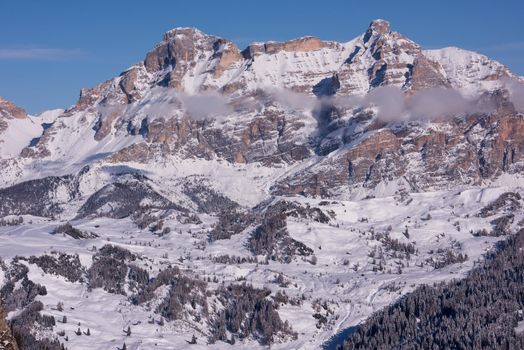 winter sunrise with fresh snow in alps mountains on fresh morning