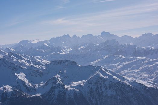 mountain landscape at winter with fresh snow on beautiful sunny day at french alps