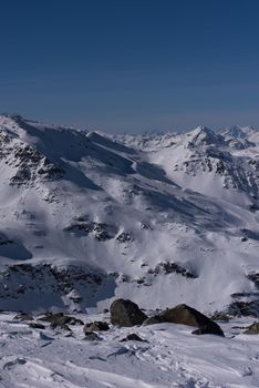 mountain landscape at winter with fresh snow on beautiful sunny day at french alps