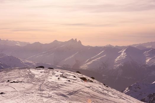 beautiful sunset on mountain at winter seasson and fresh snow