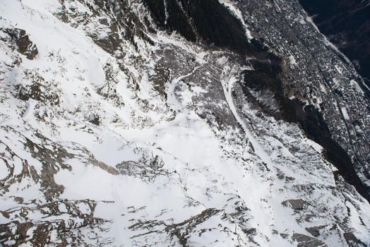 French alps mountain peaks covered with fresh snow. Winter landscape nature scene on beautiful sunny winter day.