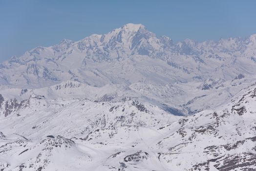 mountain landscape at winter with fresh snow on beautiful sunny day at french alps