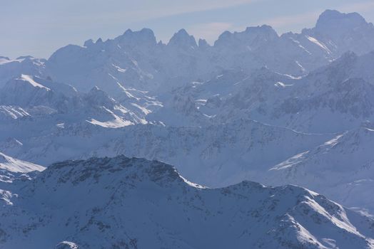 mountain landscape at winter with fresh snow on beautiful sunny day at french alps