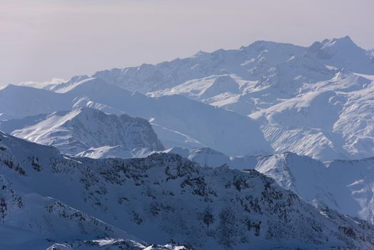 mountain landscape at winter with fresh snow on beautiful sunny day at french alps