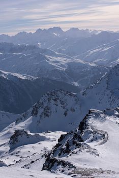 mountain landscape at winter with fresh snow on beautiful sunny day at french alps