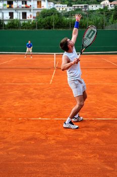 One Man play tennis on outdoor court