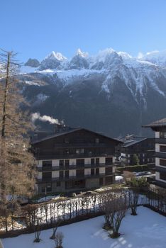 French alps mountain peaks covered with fresh snow. Winter landscape nature scene on beautiful sunny winter day.