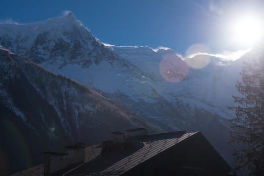 French alps mountain peaks covered with fresh snow. Winter landscape nature scene on beautiful sunny winter day.