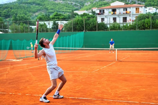 One man play tennis on outdoor court