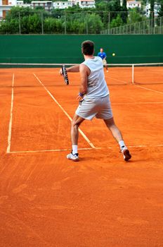 One Man play tennis on outdoor court