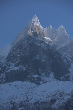 French alps mountain peaks covered with fresh snow. Winter landscape nature scene on beautiful sunny winter day.