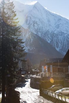 French alps mountain peaks covered with fresh snow. Winter landscape nature scene on beautiful sunny winter day.