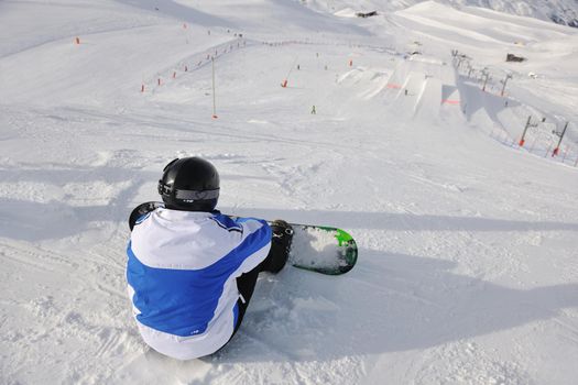 extreme freestyle ski jump with young man at mountain in snow park at winter season