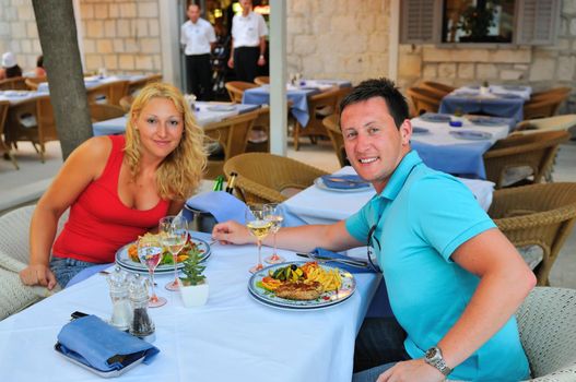 Young couple having dinner together