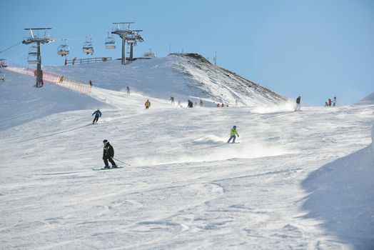 jumping skier at mountain winter snow fresh suny day