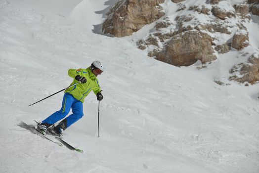 jumping skier at mountain winter snow fresh suny day