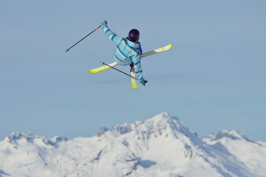 jumping skier at mountain winter snow fresh suny day