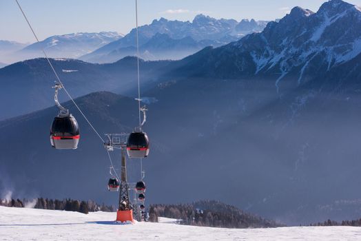 modern gondola lift at ski resort on sunny winter day