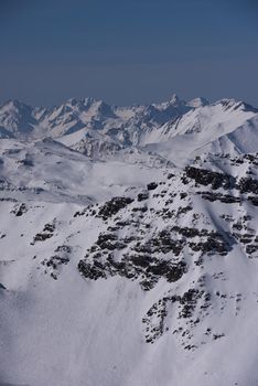 mountain landscape at winter with fresh snow on beautiful sunny day at french alps