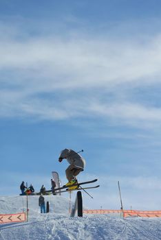 jumping skier at mountain winter snow fresh suny day