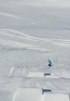 jumping skier at mountain winter snow fresh suny day