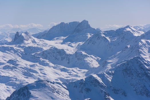 mountain landscape at winter with fresh snow on beautiful sunny day at french alps