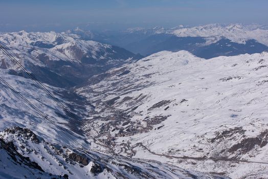 mountain landscape at winter with fresh snow on beautiful sunny day at french alps