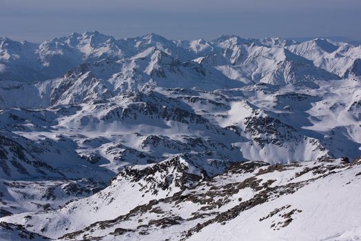 mountain landscape at winter with fresh snow on beautiful sunny day at french alps