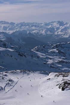 mountain landscape at winter with fresh snow on beautiful sunny day at french alps