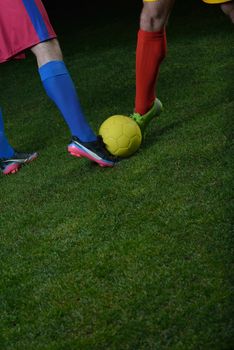 soccer player doing kick with ball on football stadium  field  isolated on black background