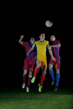 soccer player doing kick with ball on football stadium  field  isolated on black background