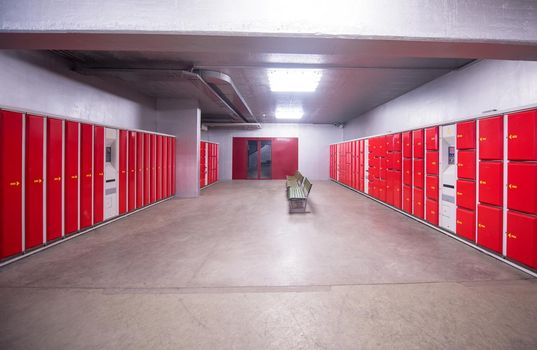 red safety lockers in empty Lockers Room