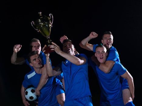 soccer players team group celebrating the victory and become champion of game while holding win coup