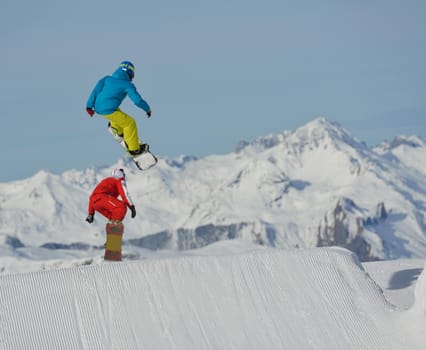 jumping skier at mountain winter snow fresh suny day