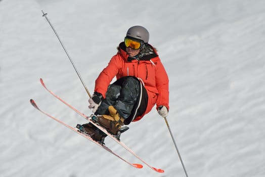 jumping skier at mountain winter snow fresh suny day