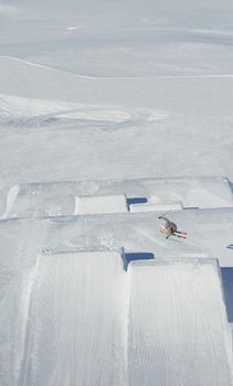 jumping skier at mountain winter snow fresh suny day