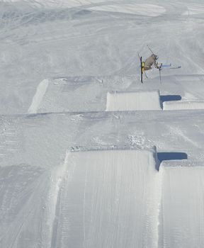 jumping skier at mountain winter snow fresh suny day