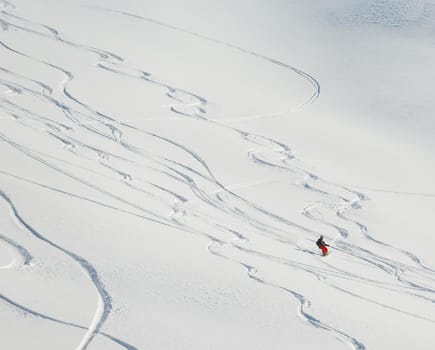 jumping skier at mountain winter snow fresh suny day