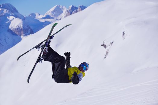 jumping skier at mountain winter snow fresh suny day