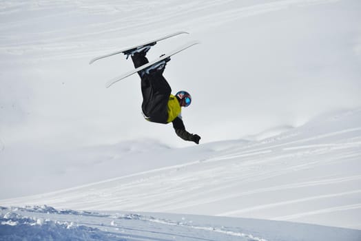 jumping skier at mountain winter snow fresh suny day