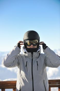 happy young man have fan while relaxing at snow with ski and snowboard sport at winter season