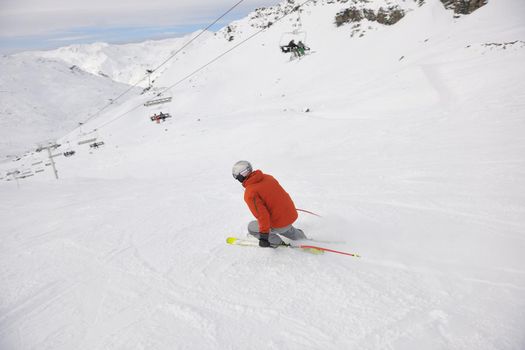 young athlete man have fun during skiing sport on hi mountain slopes at winter seasson and sunny day