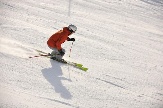 young athlete man have fun during skiing sport on hi mountain slopes at winter seasson and sunny day